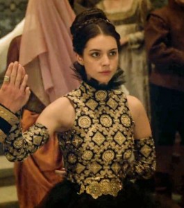 mary in Reign with rediculous gold outfit
