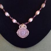 Roman coin with garnet necklace